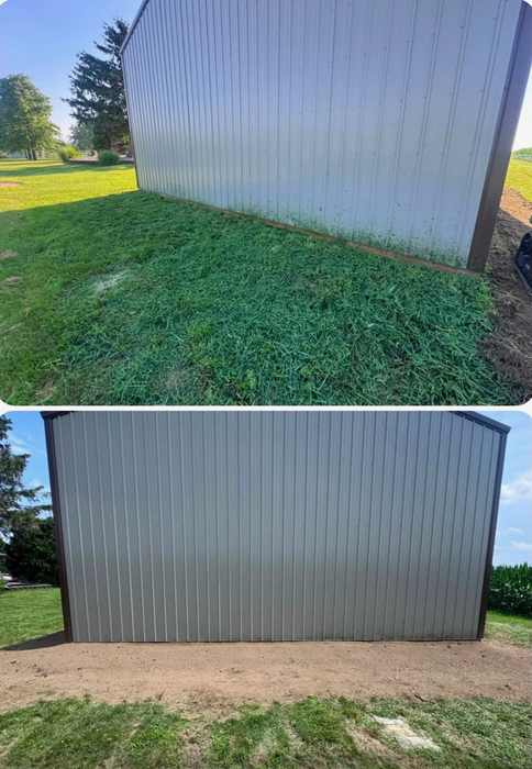 Regraded along a barn wall
