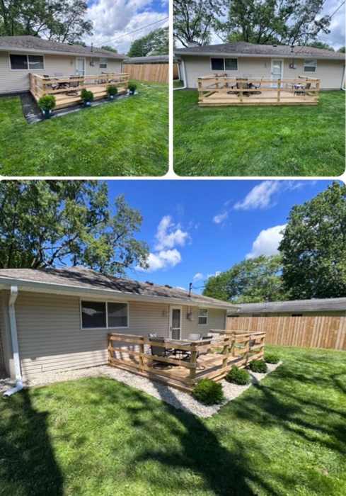 Rock border and plantings around a new deck